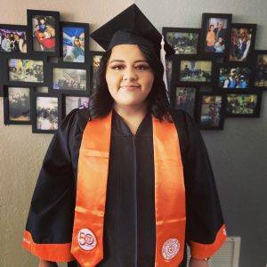 Lizeth Alvarez in graduation gown and cap
